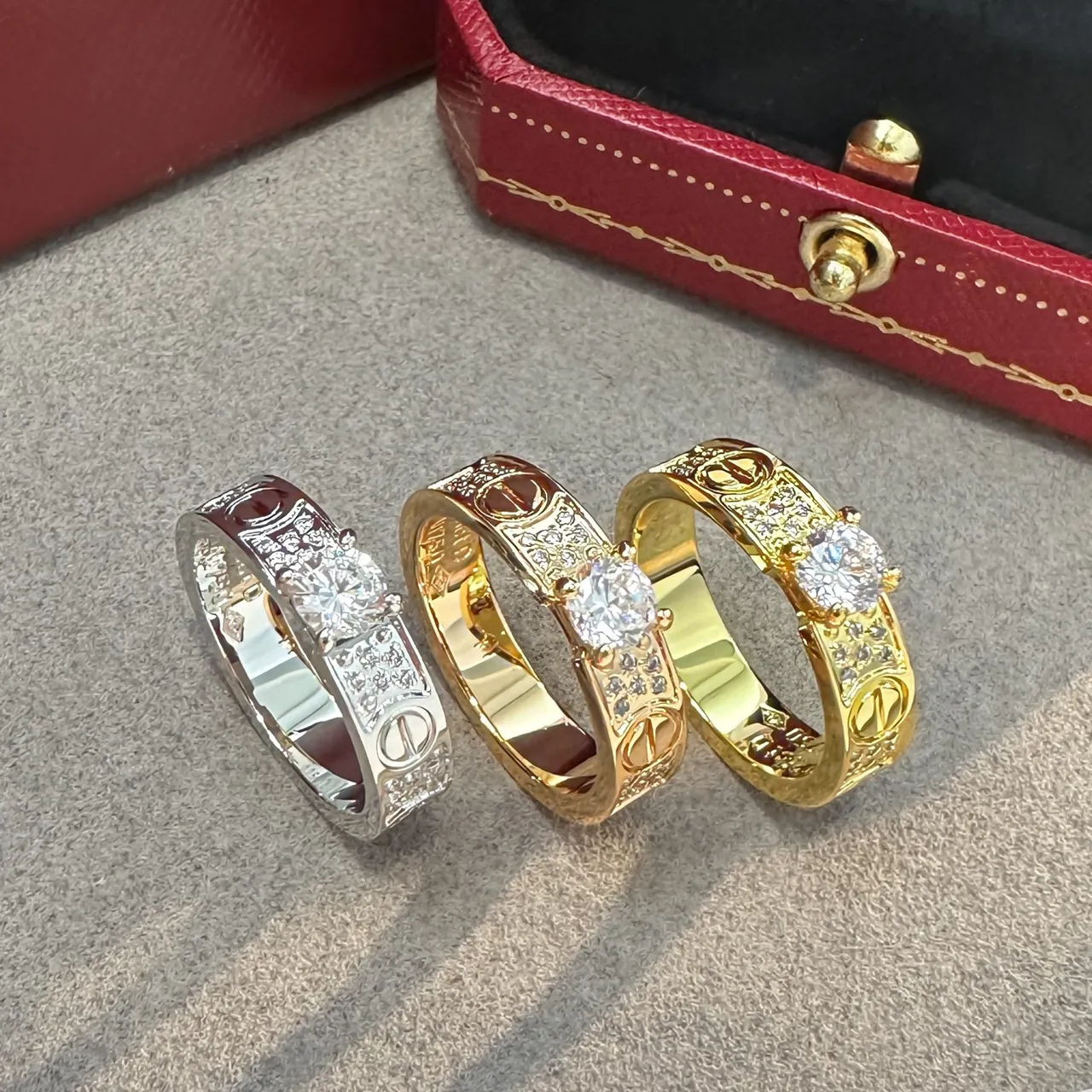Cartier Love Ring Silver and Gold Pavé Diamond Central Stone Rings