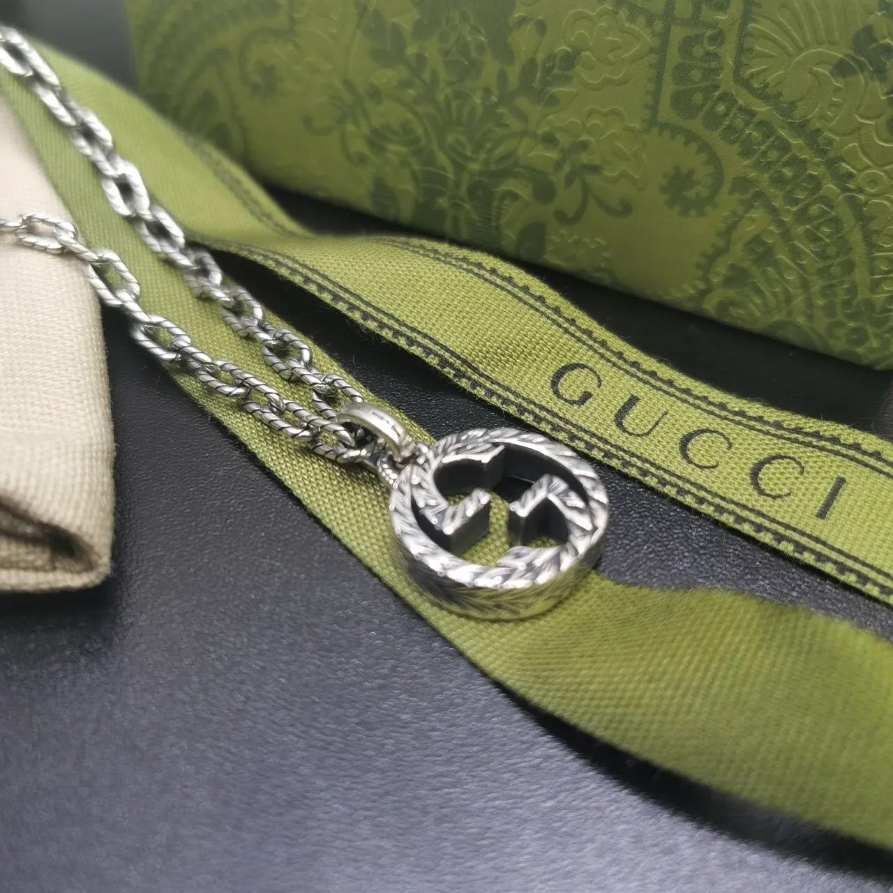 Gucci Silver Interlocking Double-G Pendant Engraved Laurel Wreath Border Necklace