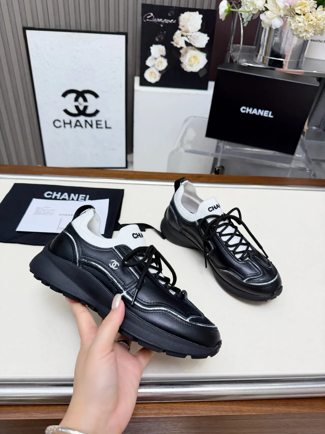 Chanel Runner-Style Sneaker Black and White Leather Lifestyle Sneakers