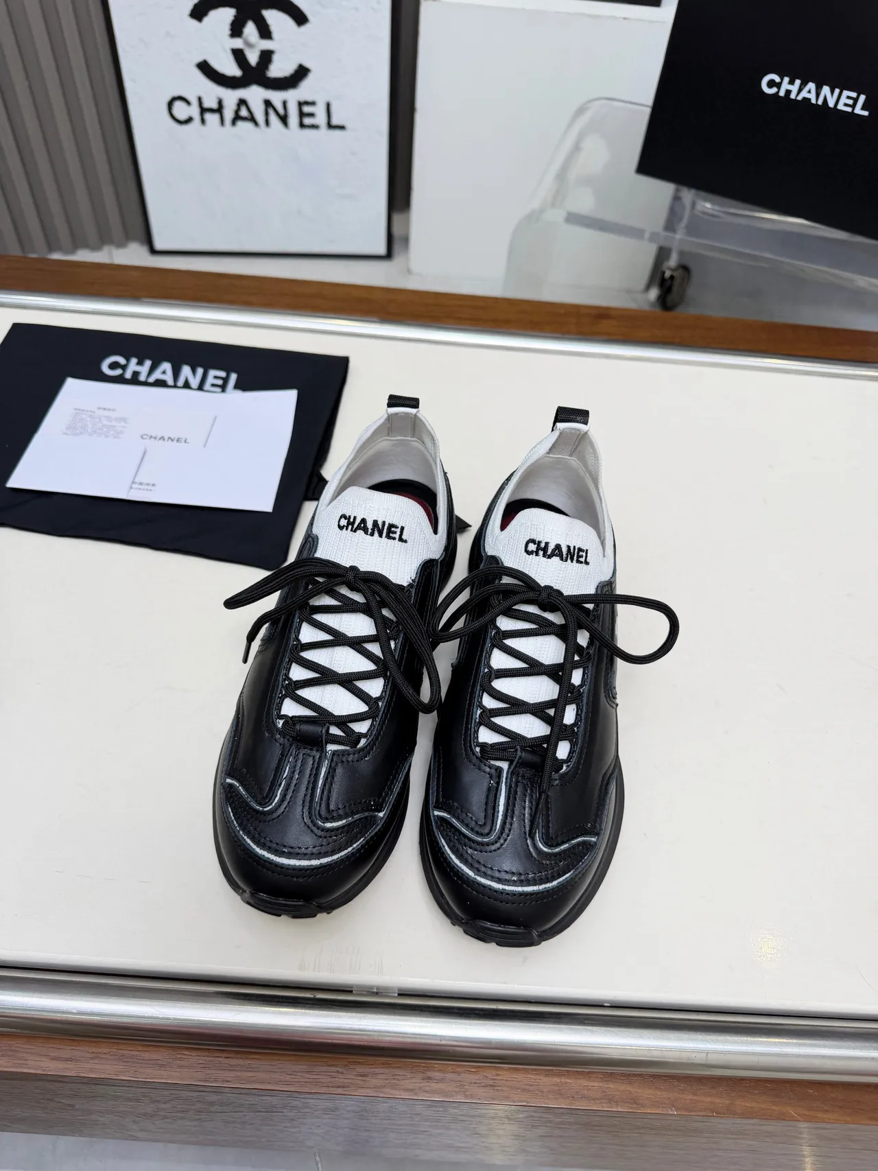 Chanel Runner-Style Sneaker Black and White Leather Lifestyle Sneakers