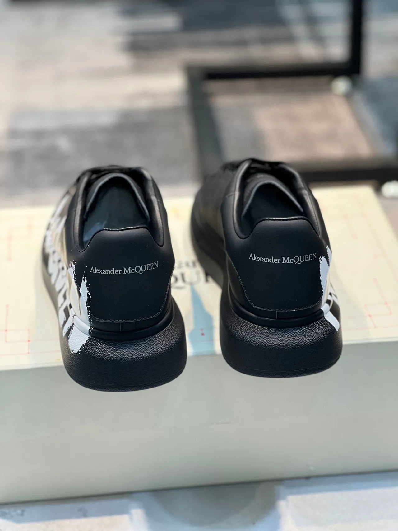 Alexander McQueen Oversized Sneaker Black White Platform Sole Graffiti-Style Logo Lifestyle Sneakers