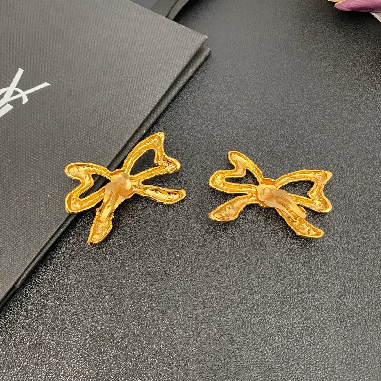 Saint Laurent Gold Sculpted Bow Textured Metal Earrings