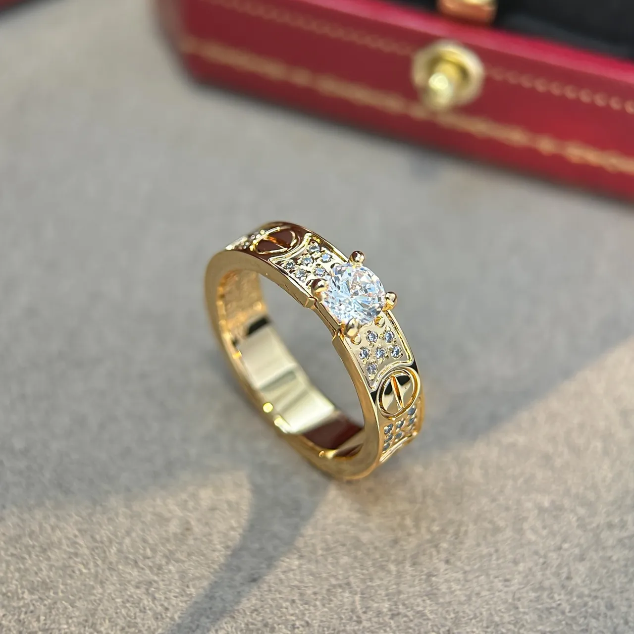 Cartier Love Ring Silver and Gold Pavé Diamond Central Stone Rings