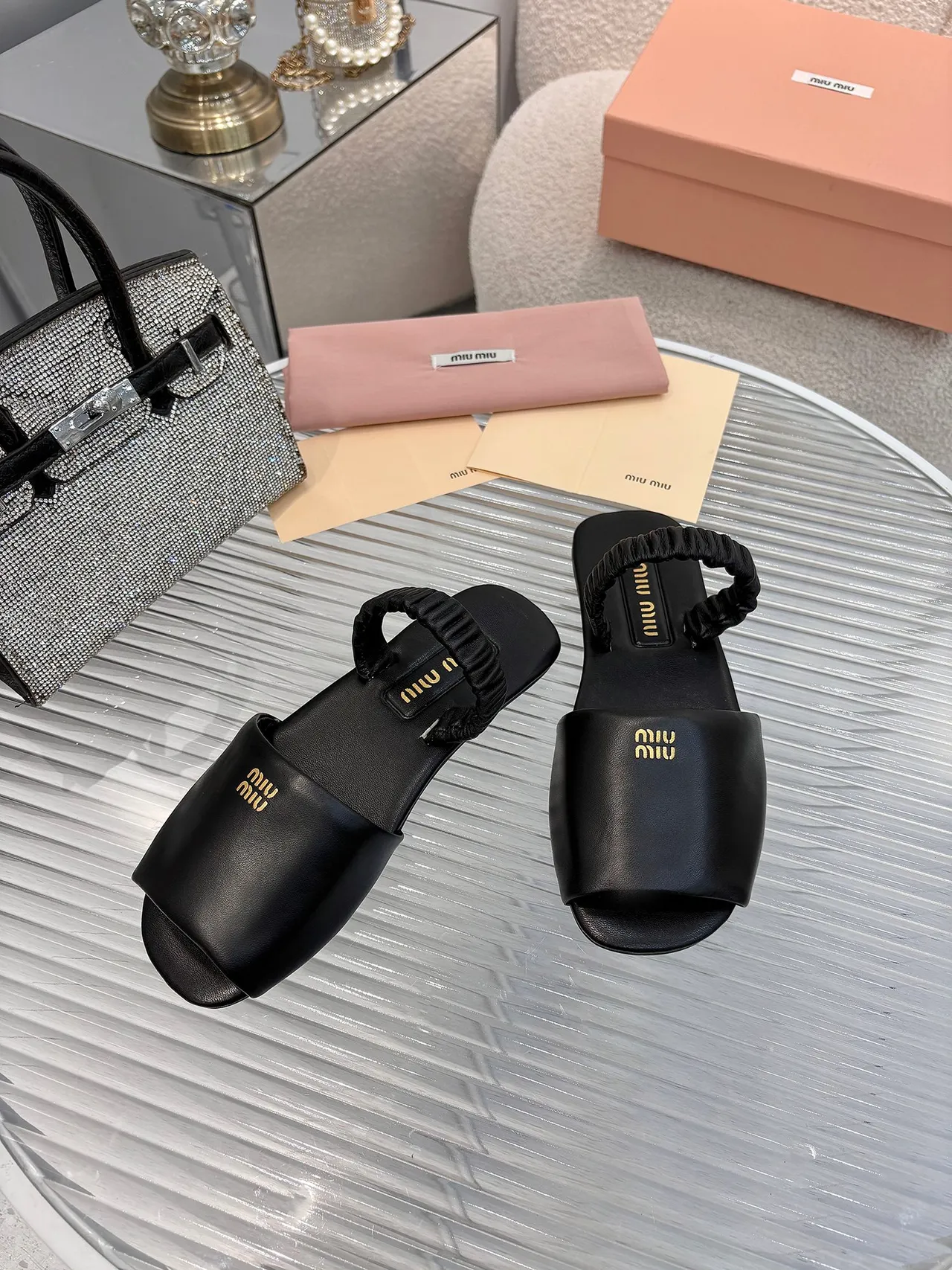 Miu Miu Black Gold Ruched Knotted Strap Logo Plaque Slippers