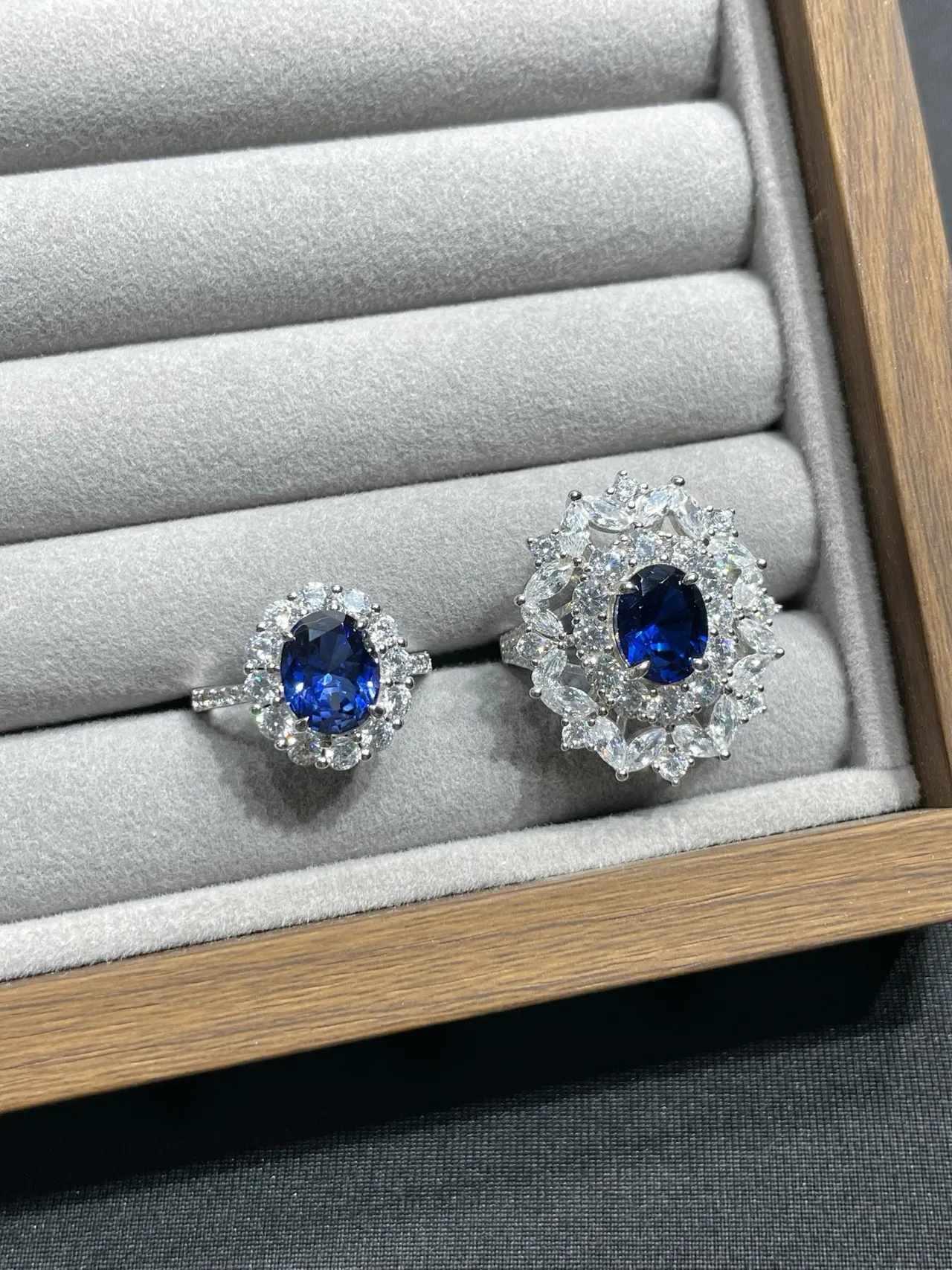 Oval Blue Gem Halo Stud Earrings