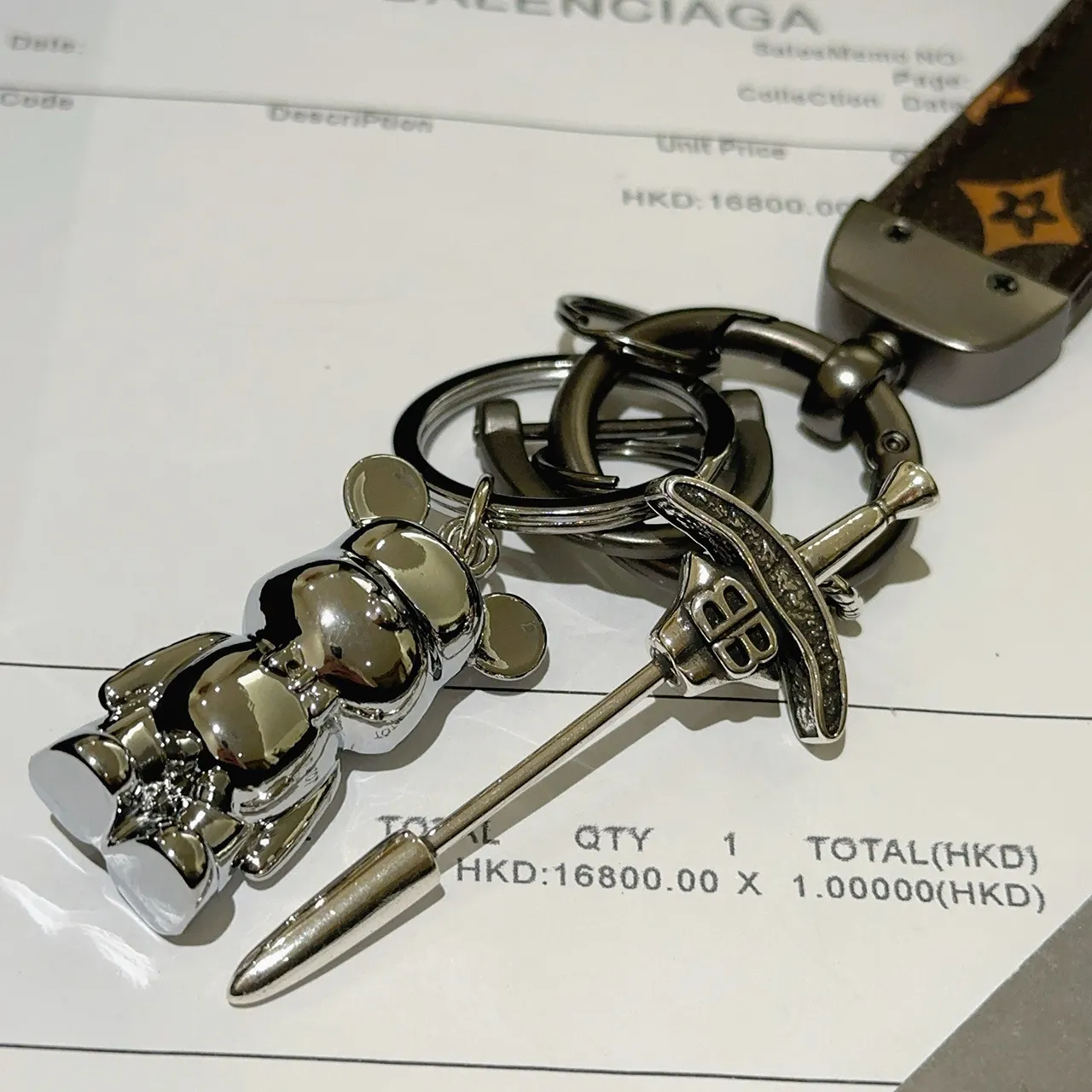 Balenciaga Bear Keychain Brown Silver Monogrammed Leather Strap Polished Metal Charm Phone Case
