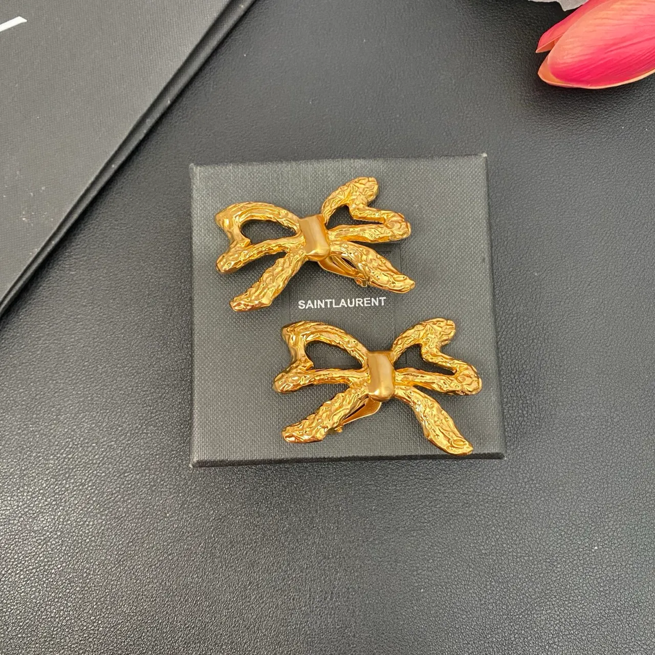 Saint Laurent Gold Sculpted Bow Textured Metal Earrings