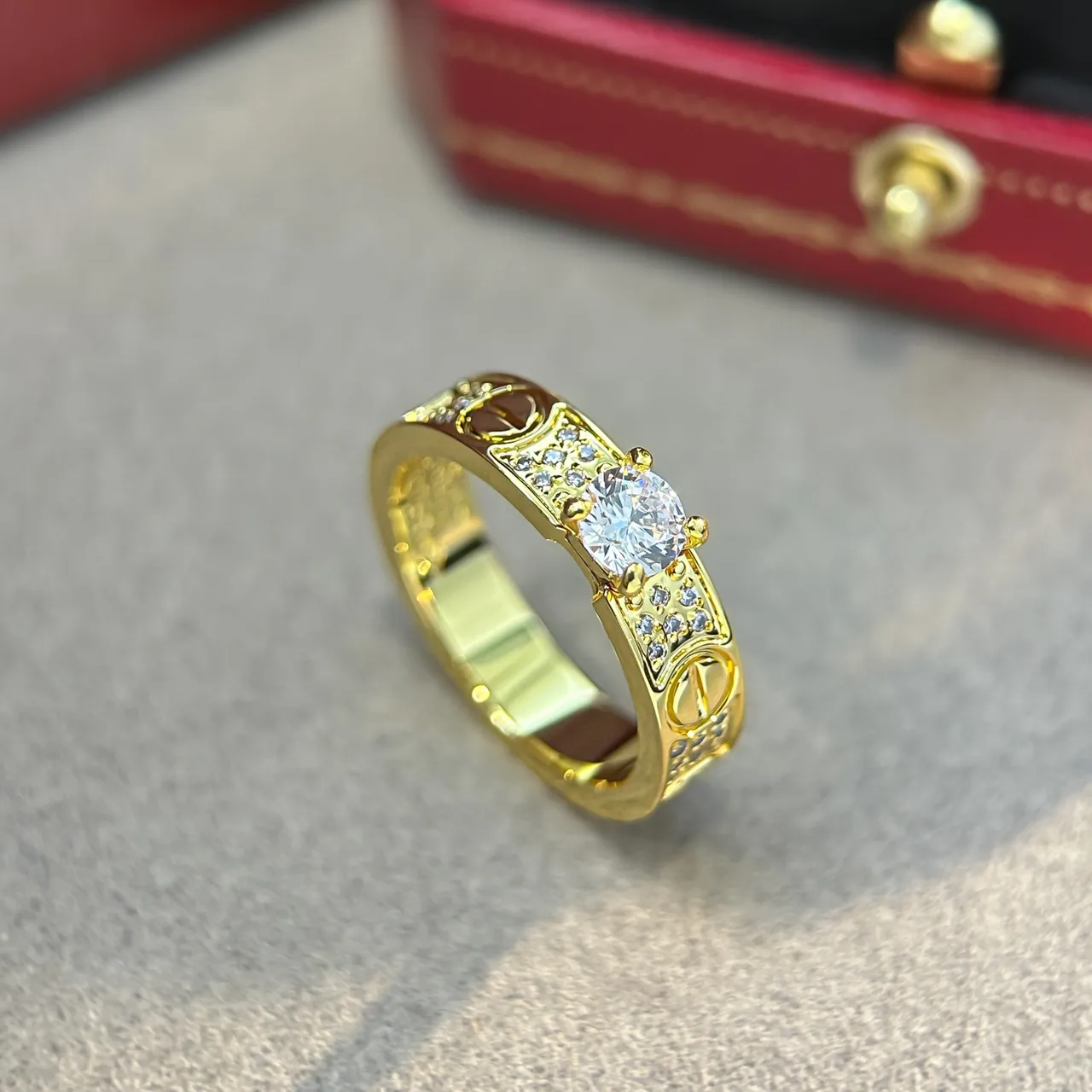Cartier Love Ring Silver and Gold Pavé Diamond Central Stone Rings