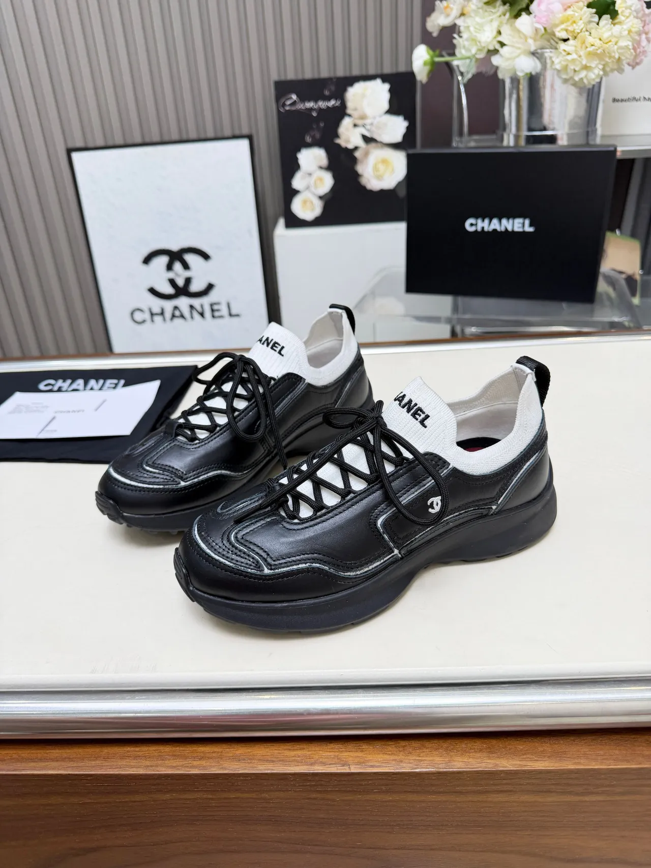 Chanel Runner-Style Sneaker Black and White Leather Lifestyle Sneakers