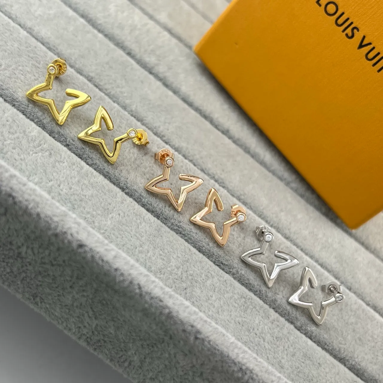 Louis Vuitton Gold Silver Star-Shaped Outline Hollow Silhouette Earrings