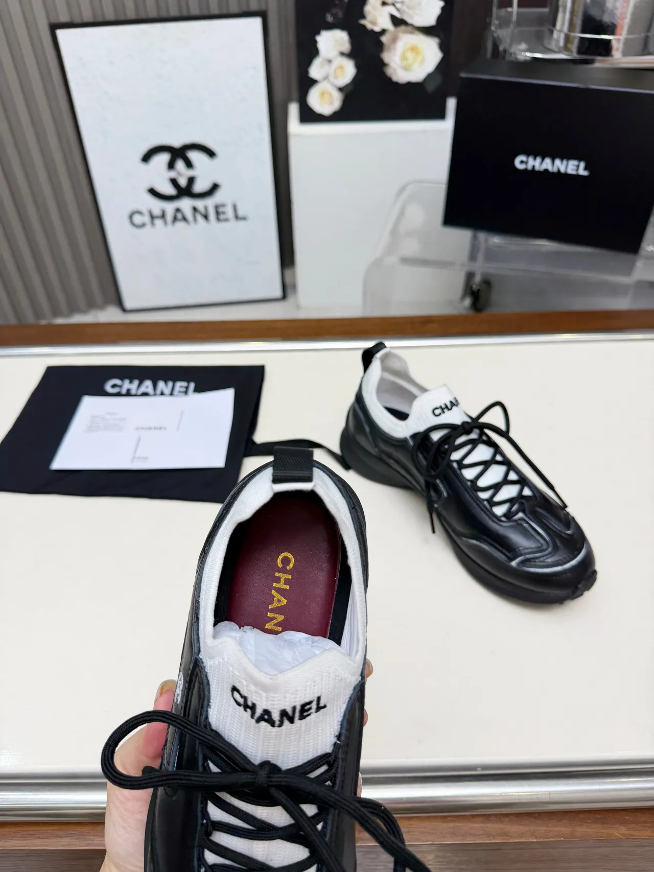Chanel Runner-Style Sneaker Black and White Leather Lifestyle Sneakers