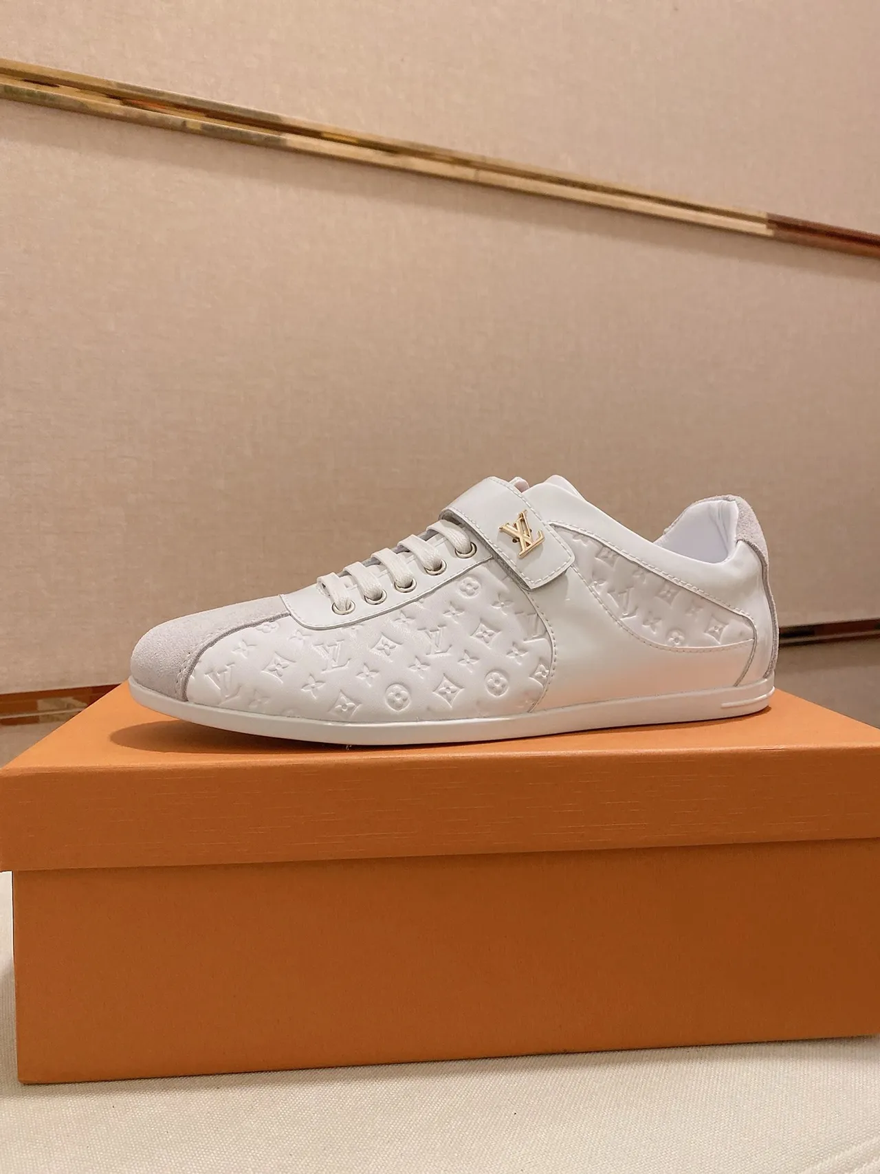 Louis Vuitton LV Trainer White Gold Monogram-Embossed Leather Suede Toe Cap Lifestyle Sneakers