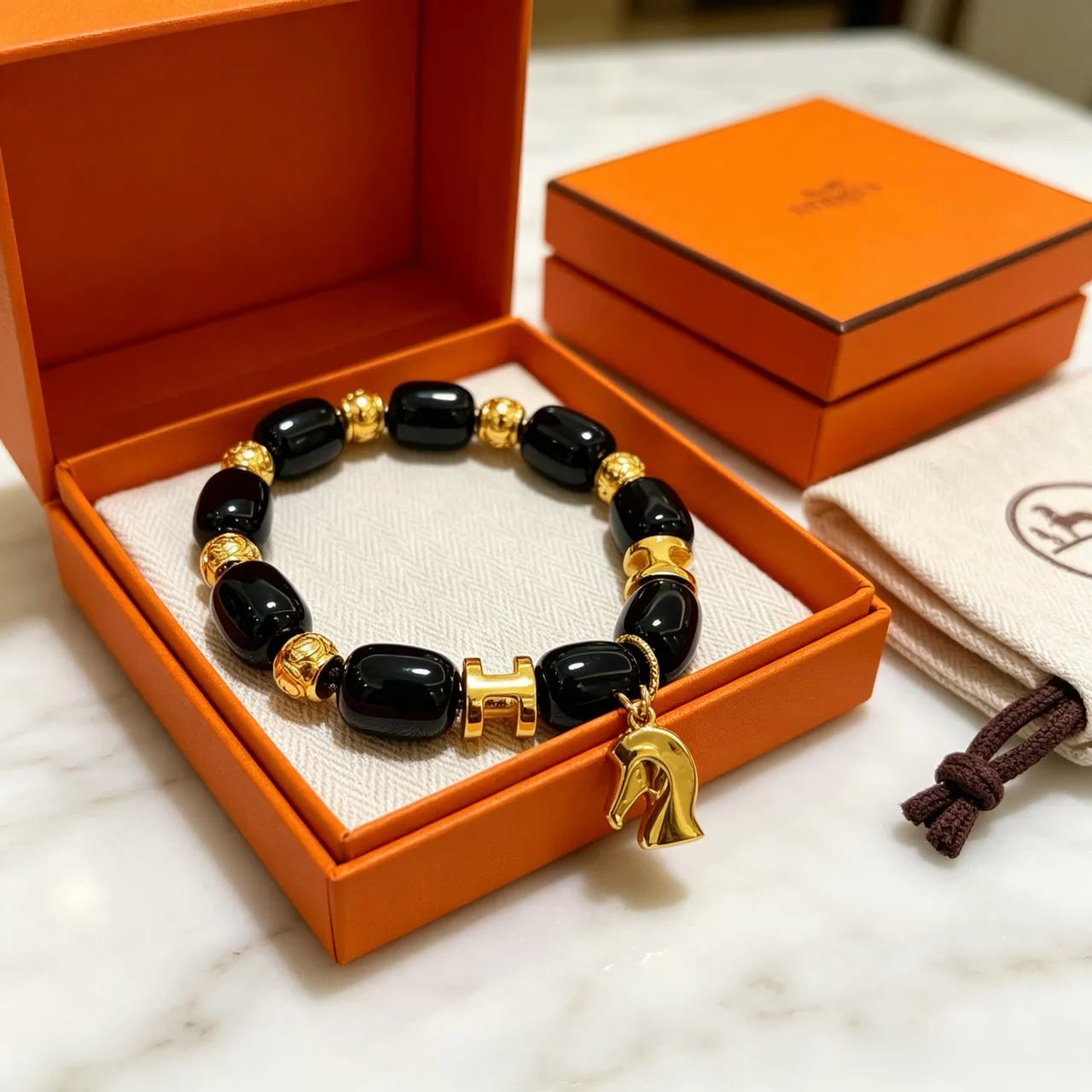 Hermès H and Horsehead Charm Black Gold Onyx-Style Beads Clasp Bracelet