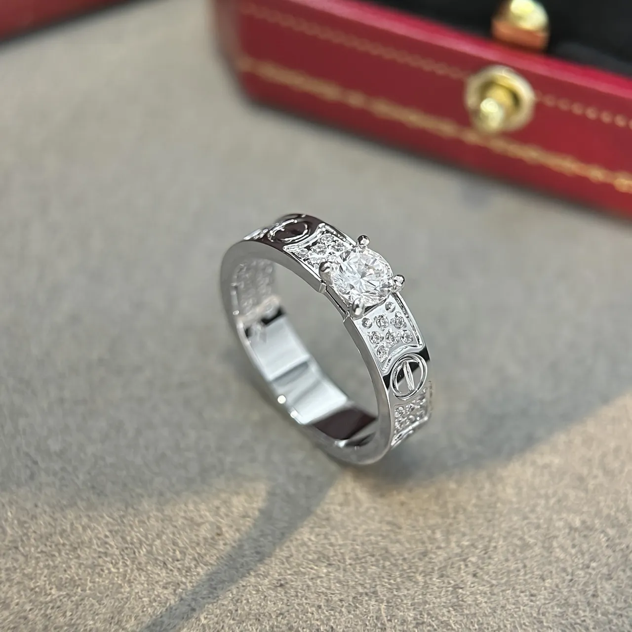 Cartier Love Ring Silver and Gold Pavé Diamond Central Stone Rings