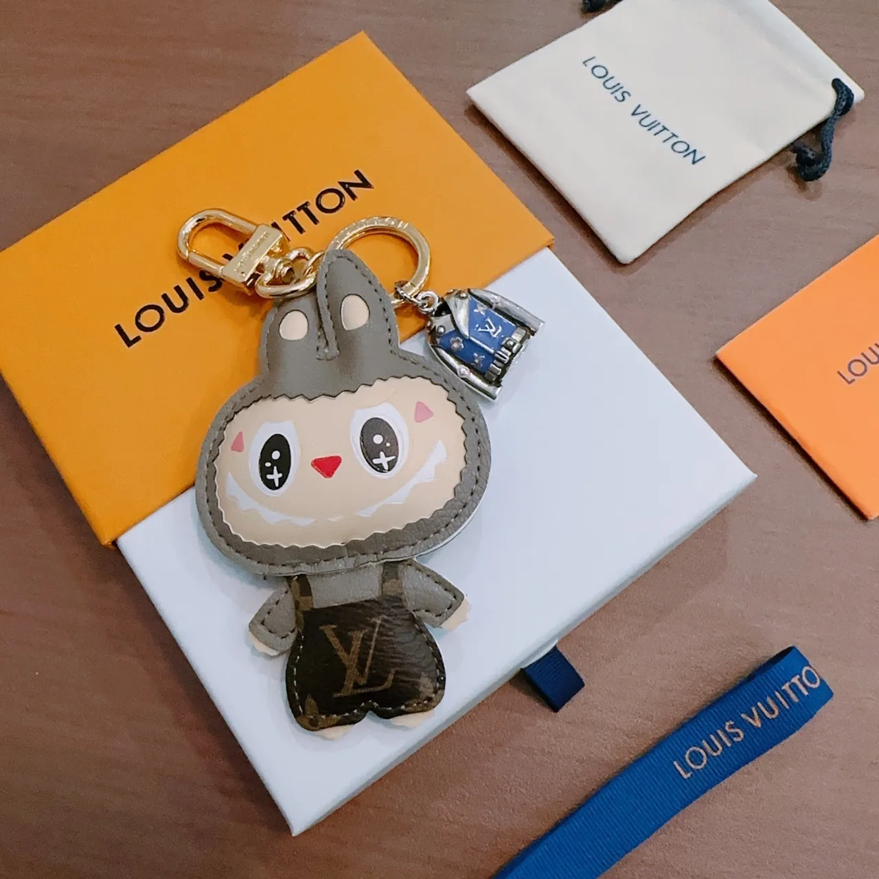 Louis Vuitton Gray Beige Plush Character Design Leather-Trimmed Appliqué Phone Accessory