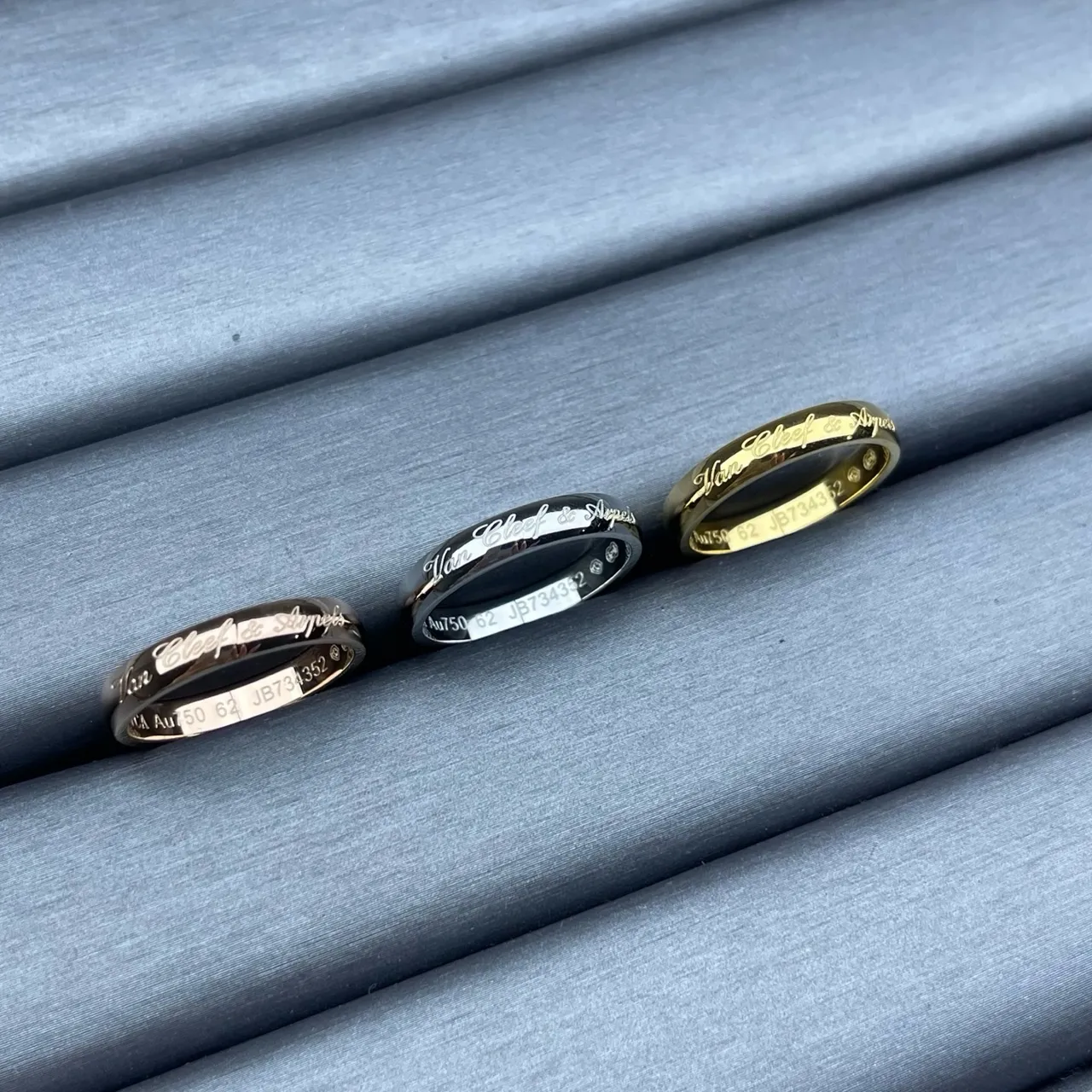 Van Cleef & Arpels Gold Black Engraved Cursive Script Polished Metal Bands Ring