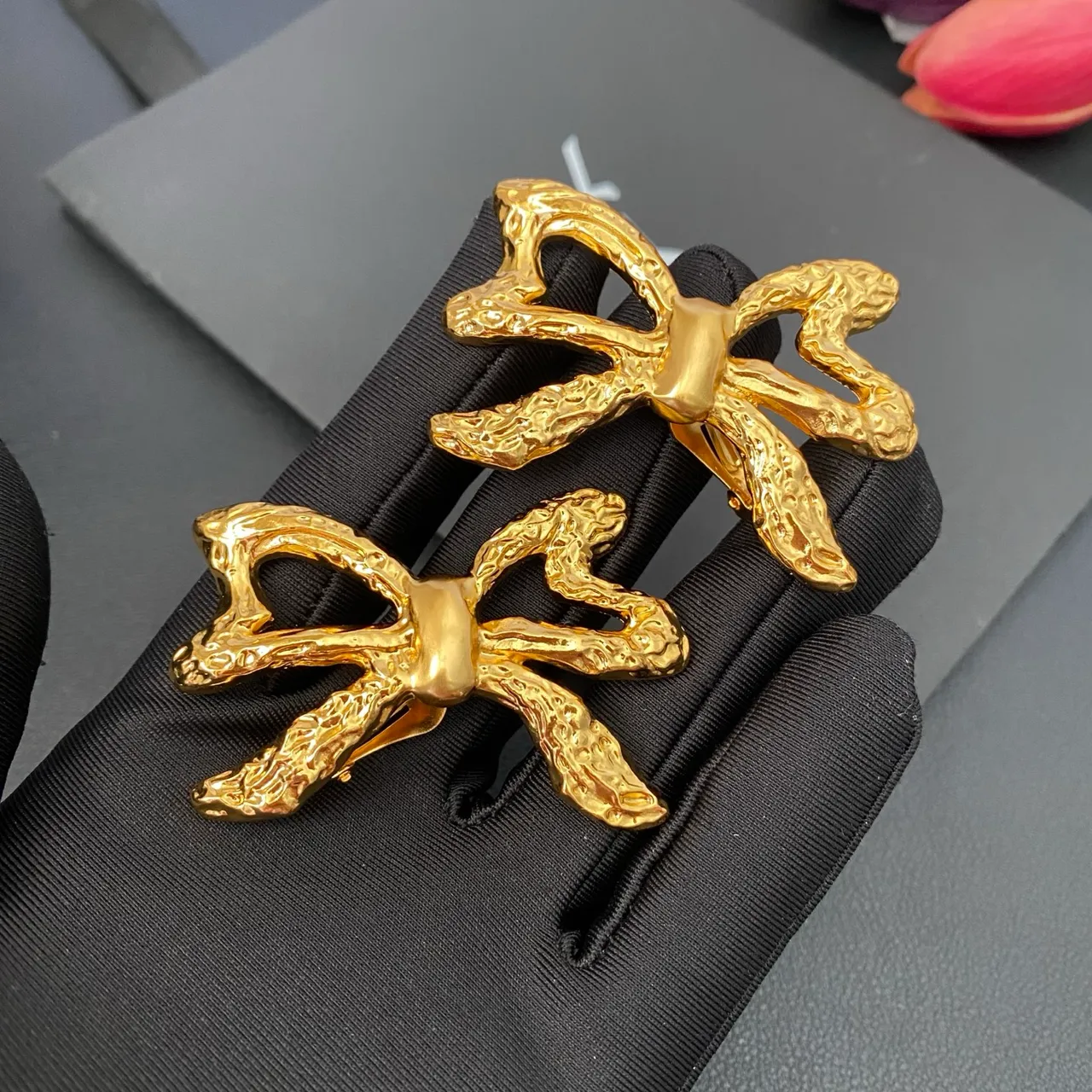 Saint Laurent Gold Sculpted Bow Textured Metal Earrings