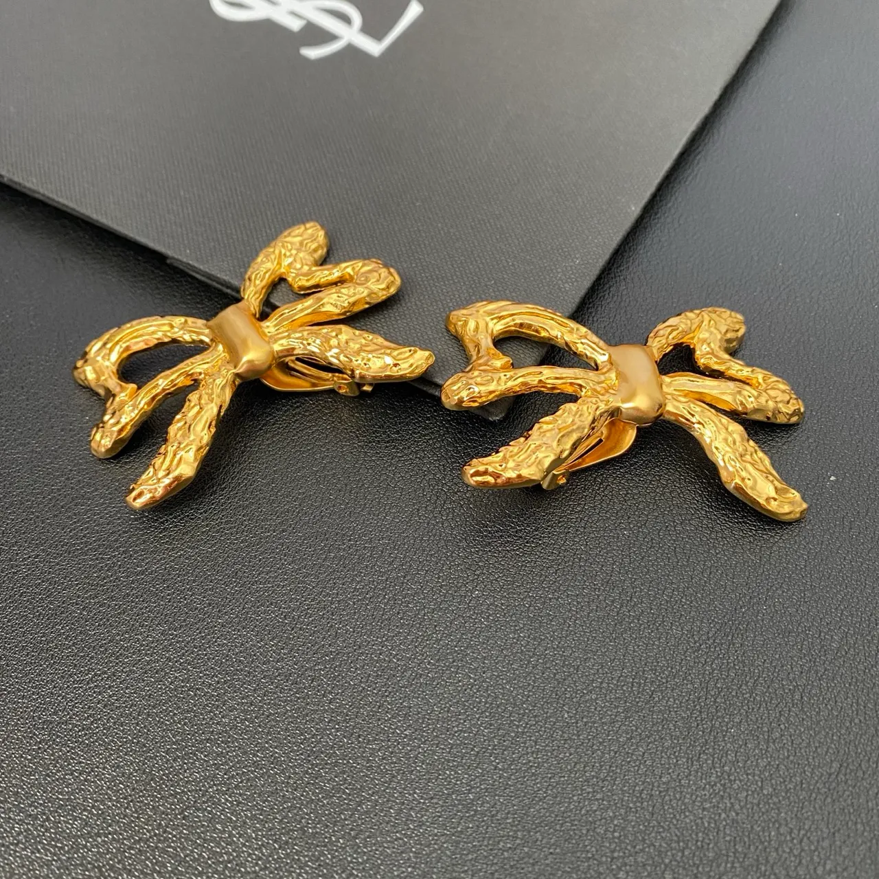 Saint Laurent Gold Sculpted Bow Textured Metal Earrings