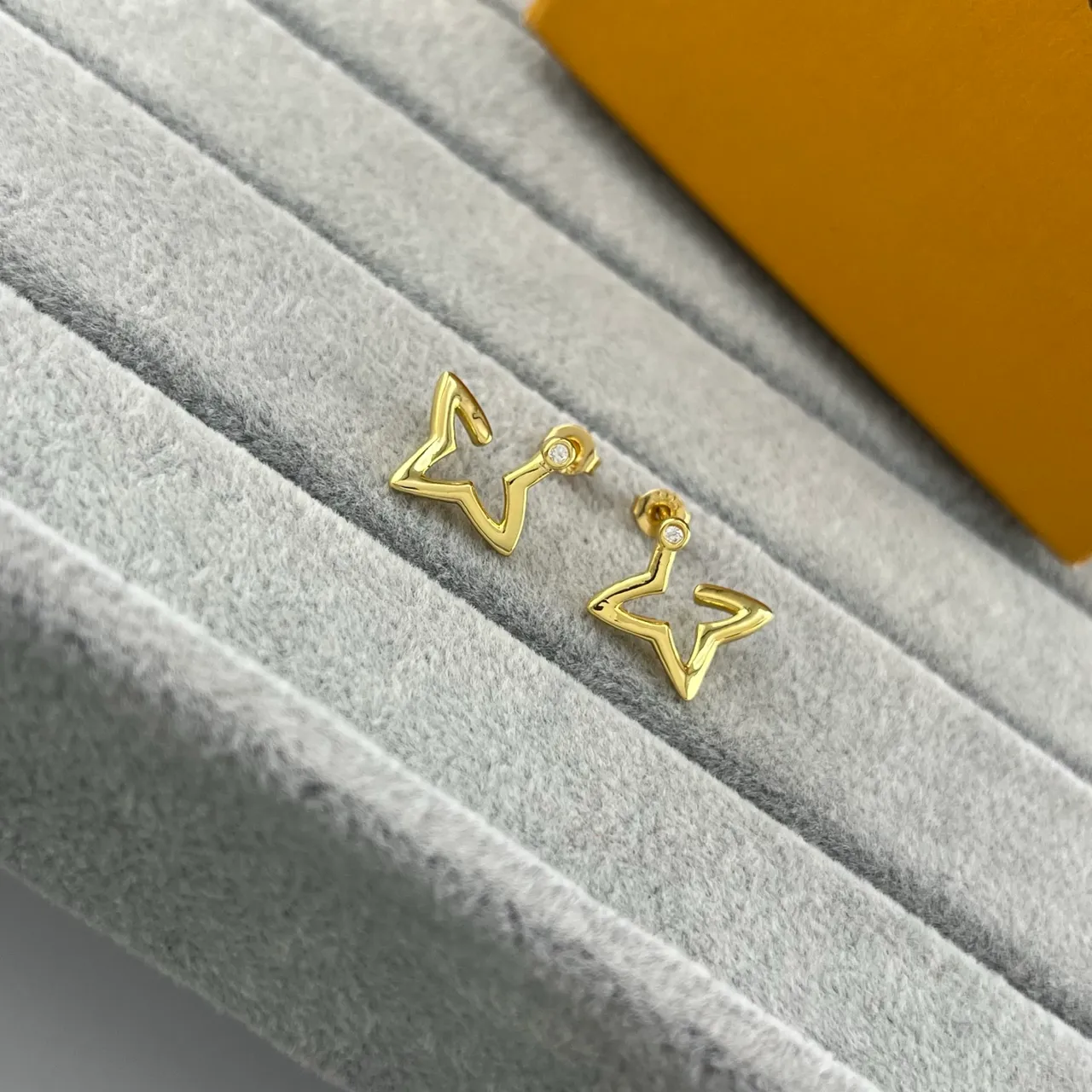Louis Vuitton Gold Silver Star-Shaped Outline Hollow Silhouette Earrings