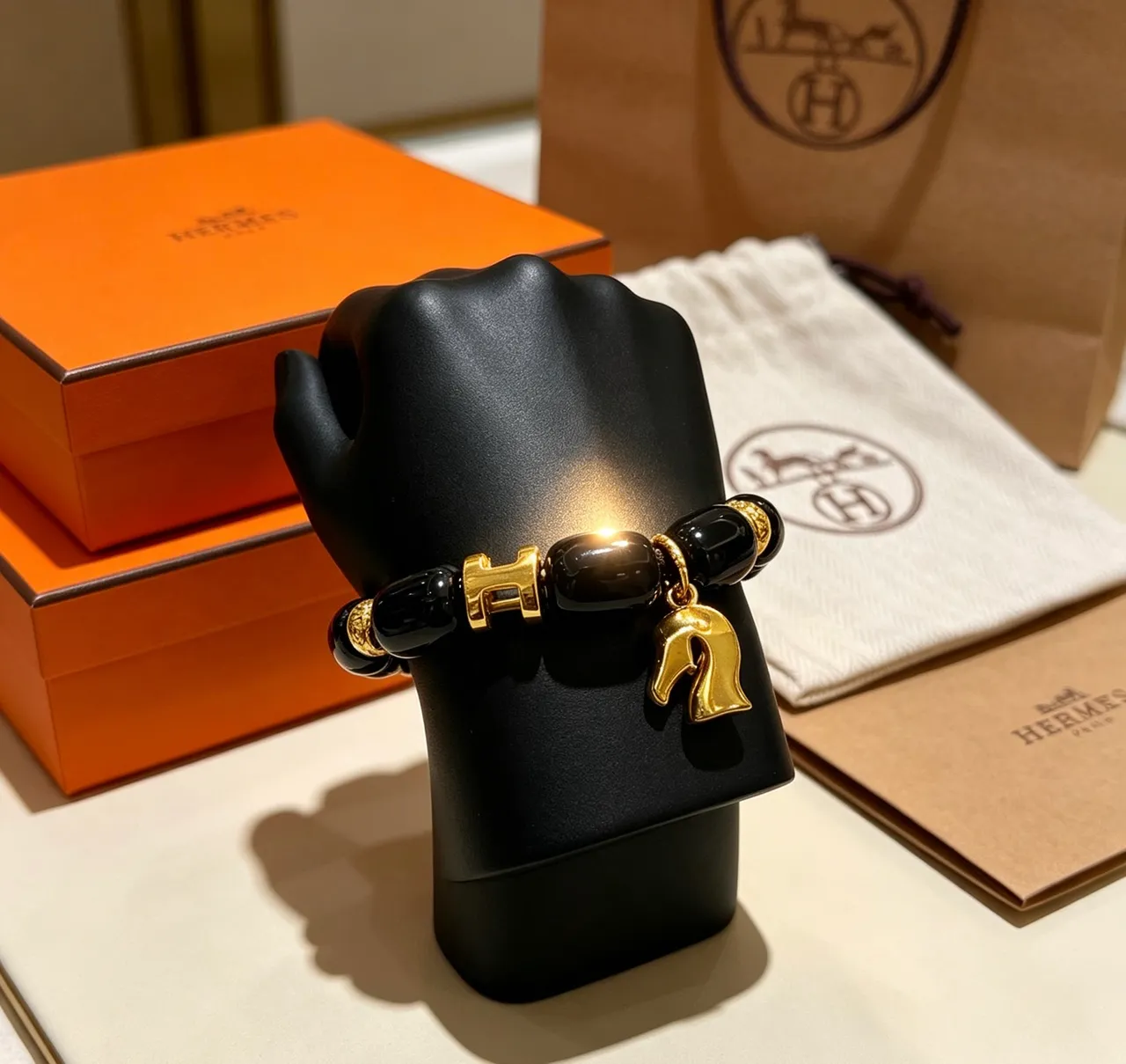 Hermès H and Horsehead Charm Black Gold Onyx-Style Beads Clasp Bracelet