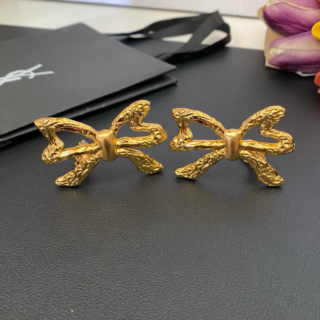 Saint Laurent Gold Sculpted Bow Textured Metal Earrings