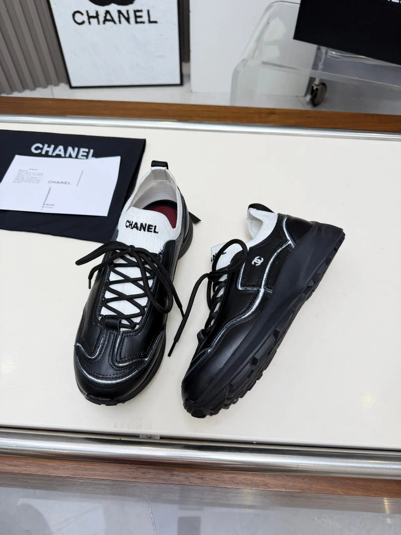 Chanel Runner-Style Sneaker Black and White Leather Lifestyle Sneakers