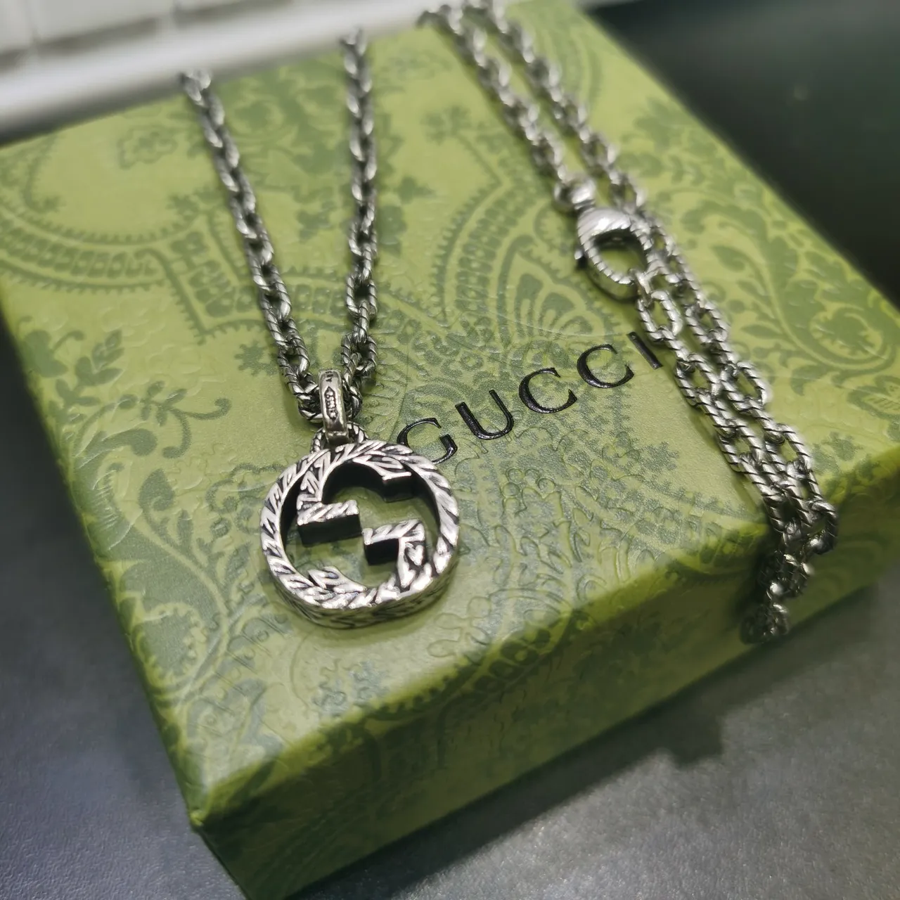 Gucci Silver Interlocking Double-G Pendant Engraved Laurel Wreath Border Necklace