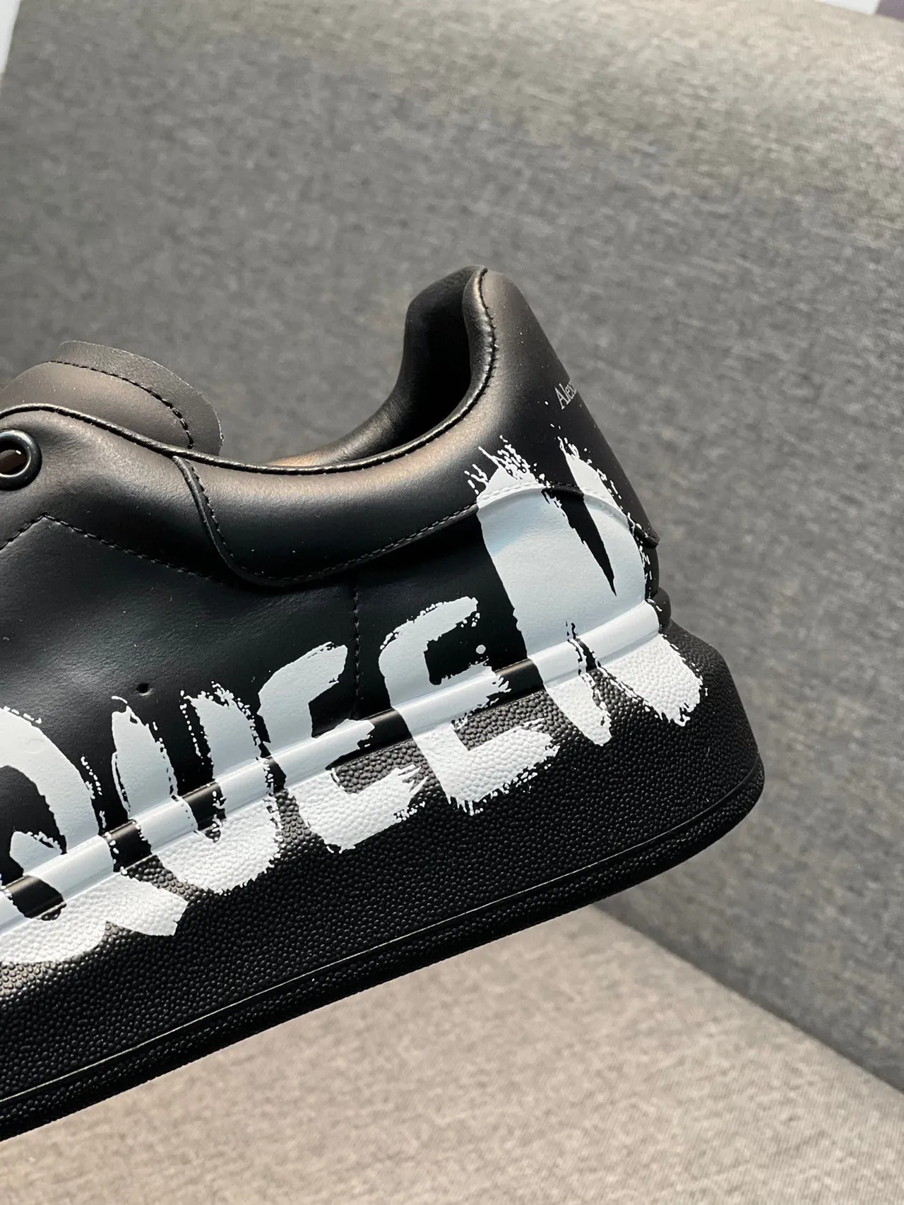 Alexander McQueen Oversized Sneaker Black White Platform Sole Graffiti-Style Logo Lifestyle Sneakers