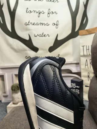 Adidas Black and White Three-Stripe Leather Low-Top Lifestyle Sneakers