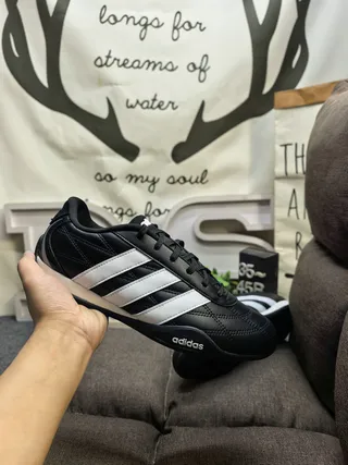 Adidas Black and White Three-Stripe Leather Low-Top Lifestyle Sneakers