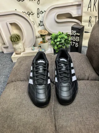 Adidas Black and White Three-Stripe Leather Low-Top Lifestyle Sneakers