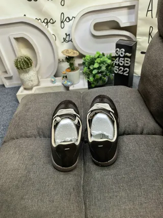 Maison Margiela Black Glossy Patent Leather Stitched Panel Construction Lifestyle Sneakers