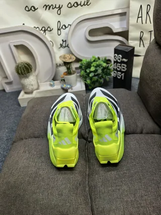 Adidas Yellow Black Asymmetrical Heel Cage Perforated Three-Stripe Design Running Shoes