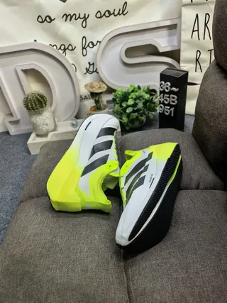 Adidas Yellow Black Asymmetrical Heel Cage Perforated Three-Stripe Design Running Shoes