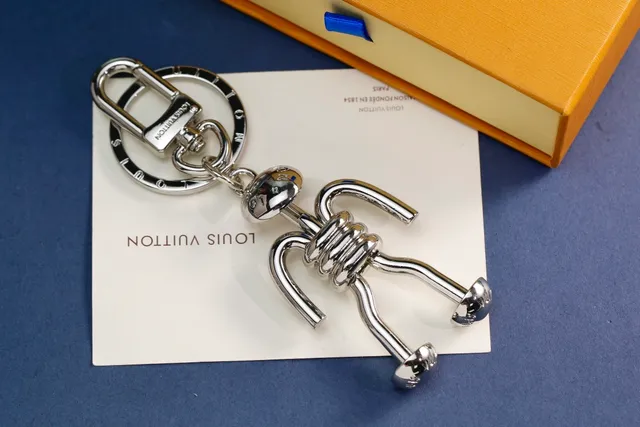 Louis Vuitton Silver Gold Articulated Stick-Figure Silhouette Coiled Torso Detail Crossbody Bag