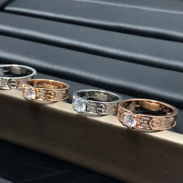 Cartier Love Ring Silver and Gold Pavé Diamond Central Stone Rings
