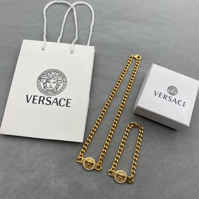 Versace Chain Reaction Medusa Head Crystal Bezel Gold-Tone Curb Chain Bracelets