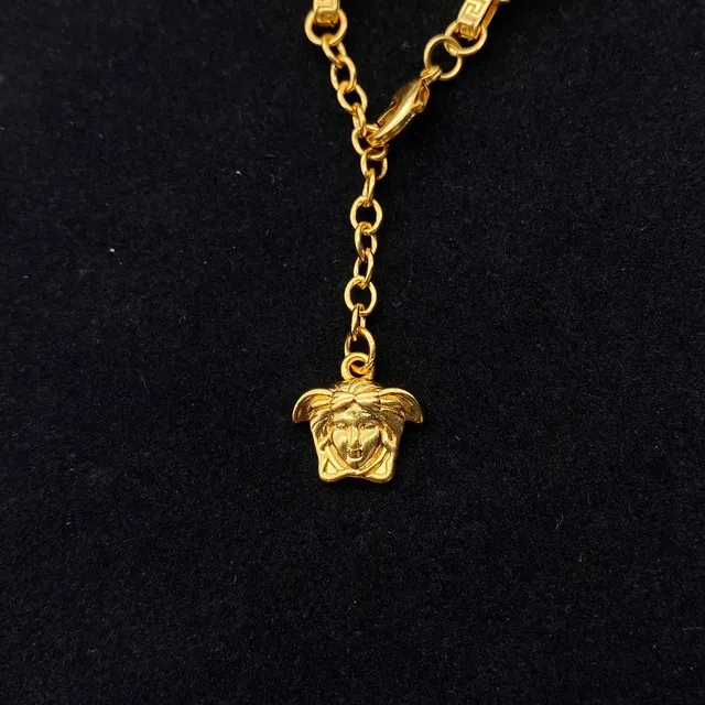Versace Gold Black Metal Enamel Medusa Heads Bracelet