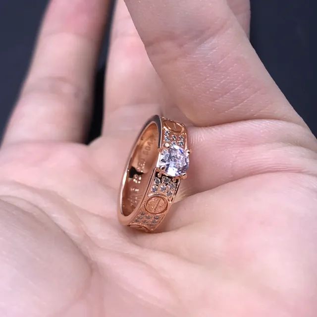 Cartier Love Ring Silver and Gold Pavé Diamond Central Stone Rings