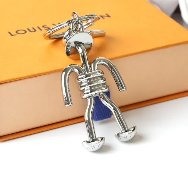 Louis Vuitton Silver Blue Polished Metal Figurine-Shaped Phone Accessory