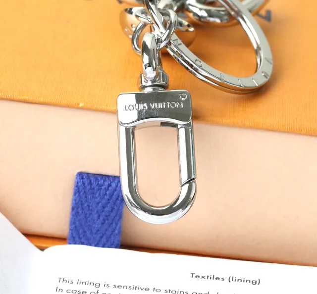 Louis Vuitton Silver Blue Polished Metal Figurine-Shaped Phone Accessory