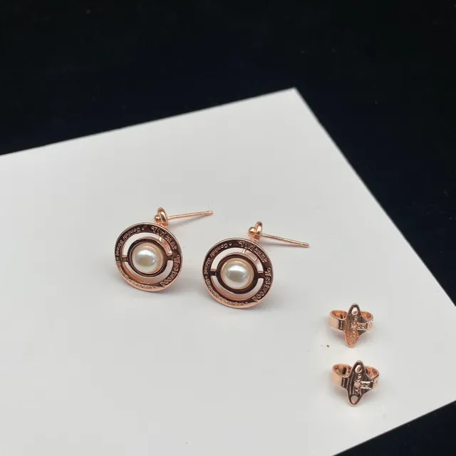 Vivienne Westwood Orb Pearl Black Gold Metallic Frame Central Cultured Earrings
