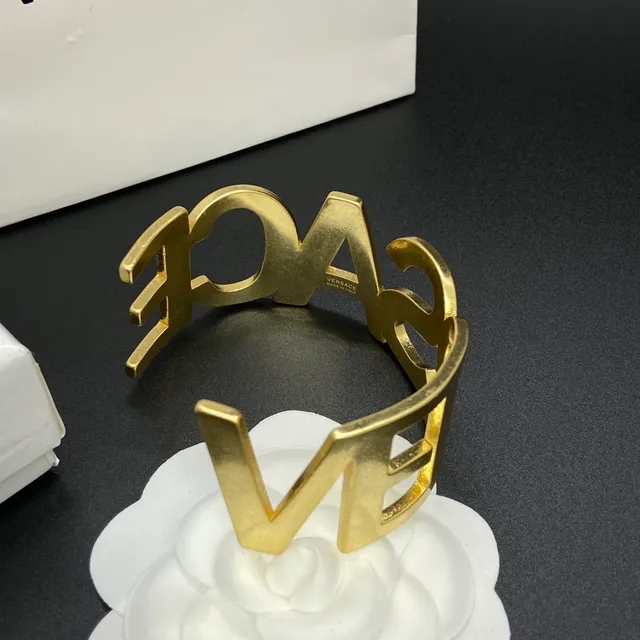 Versace Odissea Bold Lettering Gold-Tone Cuff Bracelet